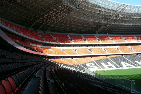 A sports arena without people, the inscription is visible in the distance