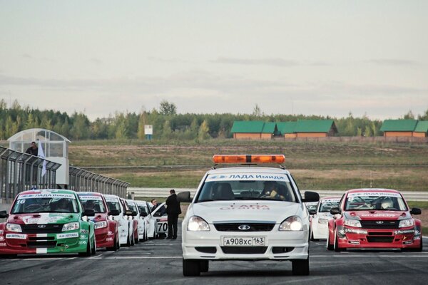 Car racing in the foreground of lada granta