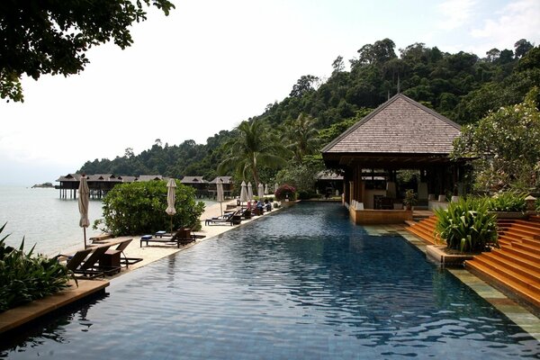 Relaxing with a beautiful exterior in a blue water pool