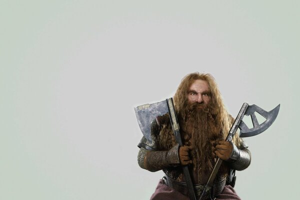 Gimli the dwarf from the Lord of the Rings with an axe and an axe