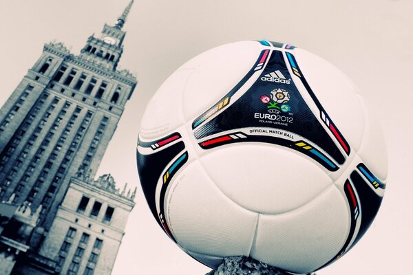 Soccer ball in Poland in the air next to the tower