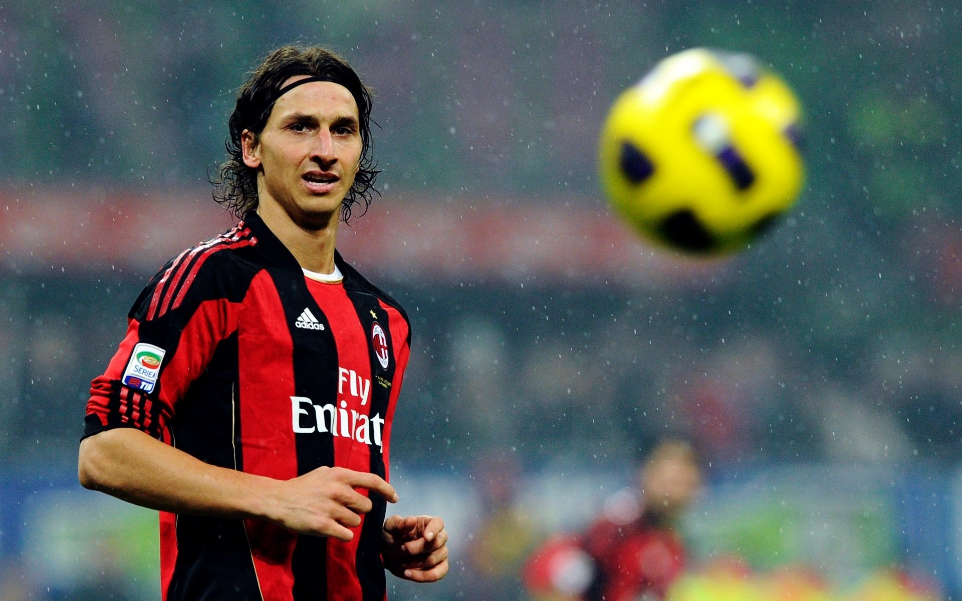 football footballer zlatan ibrahimovic milan looks yellow ball rain