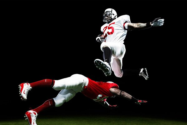 American Football players in the jump