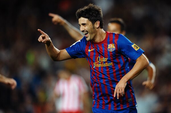 La star del calcio David Villa celebra il gol segnato durante la partita Barcellona-Atlético