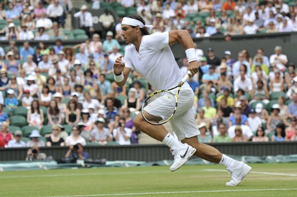 Rafael Nadal runs for the ball