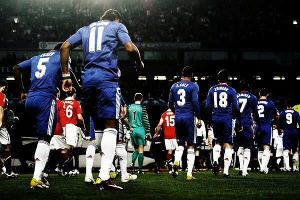 Photos of Chelsea and Manchester United teams at a football match