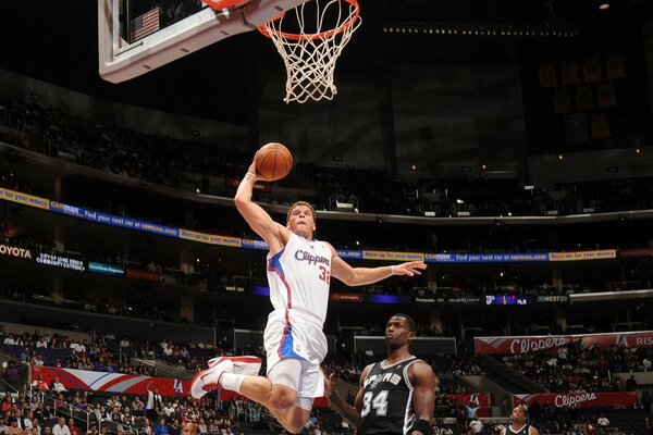 Basketball player Blake Griffin in a jump at the ring
