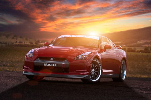 Bright red car at sunset in the field