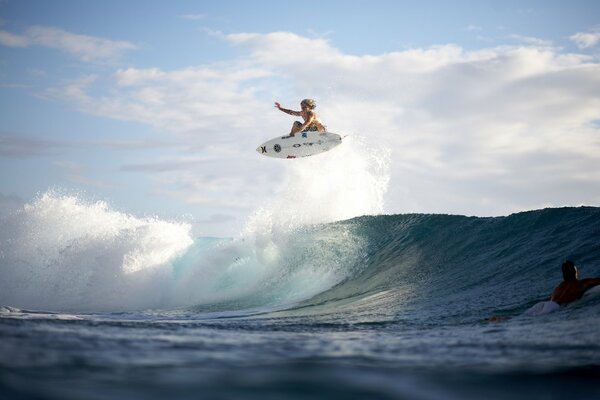 Surfboard jump over a wave