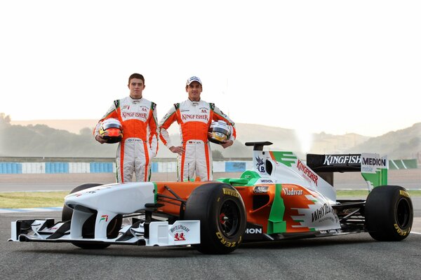 Two racers and a Formula 1 car