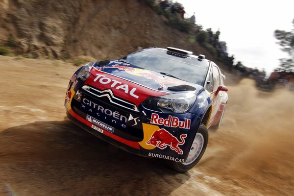 Citroen skidding under the control of Sebastian Loeb at the rally