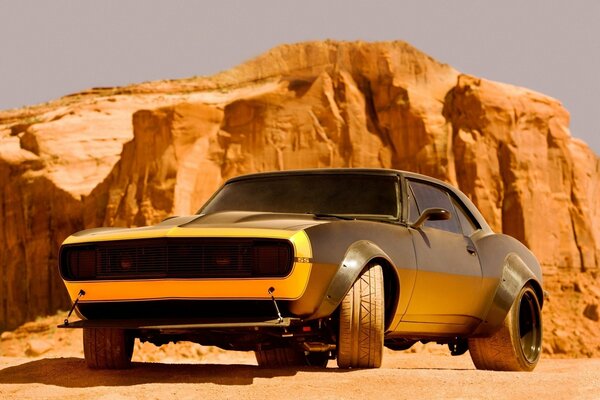 Black car on a background of red rocks