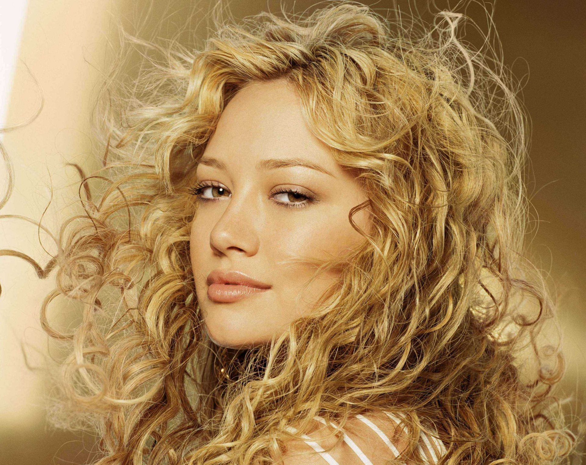 hilary duff blonde hair curls view lips actress white background