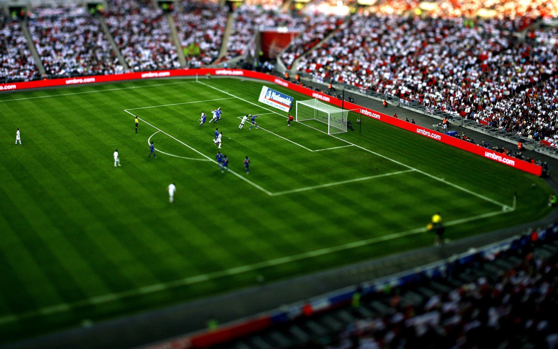 deportes estadios hierba juego chicos jugadores de fútbol juegos personas persona situaciones situación pelotas portería azul blanco cambio e inclinación