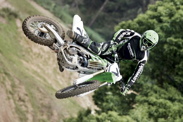 Photo of a motorcyclist on a bike in a jump