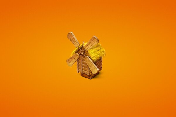 Painted wooden mill on an orange background