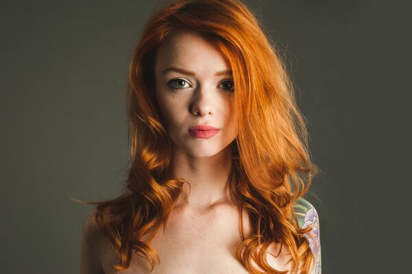 A girl with red hair and red lips