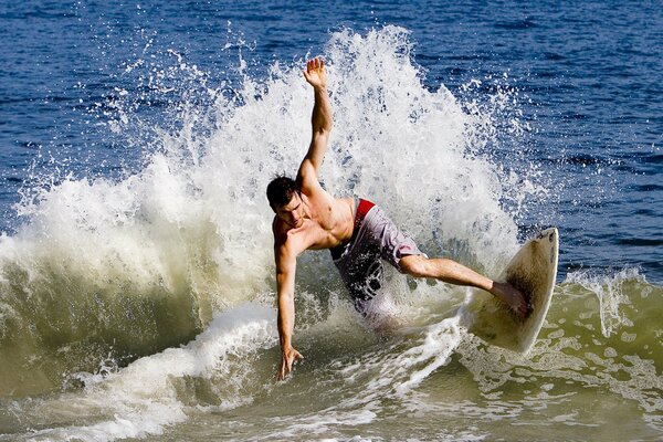 A man on a surfboard on the Volga sea