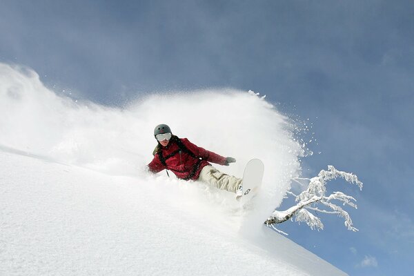 Snowboarding means mountains, downhill, warm winter and a sea of snow