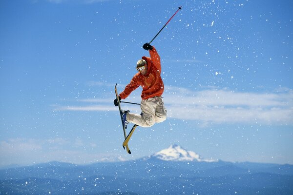 Skier s jump against the sky
