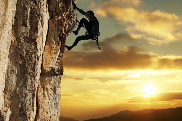 A climber climbs into the mountains. Beautiful background