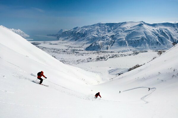Downhill skiing in the mountains. Valley