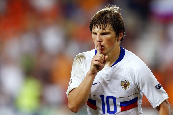 Arshavin holds his finger across his lips