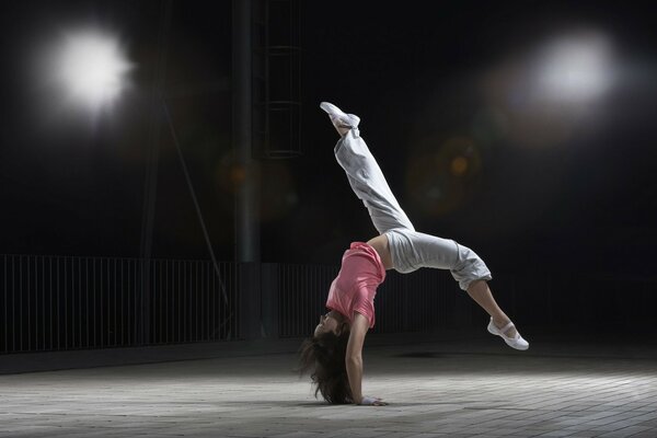 A girl performing an acrobatic element