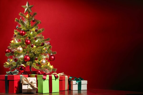 Christmas tree decorated with Christmas balls with gifts