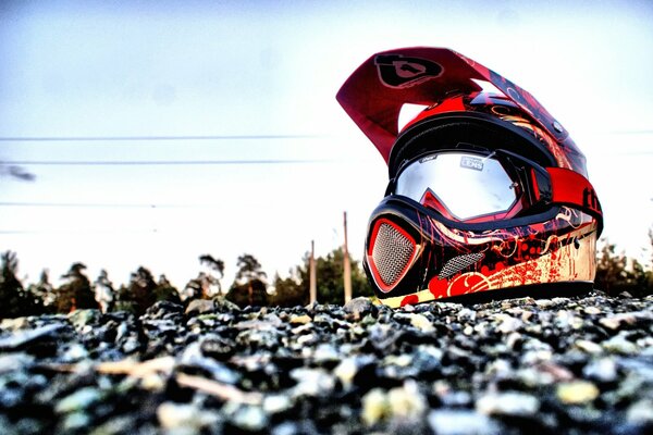 HELMET UNDER THE OPEN SKY ON THE ROCKS