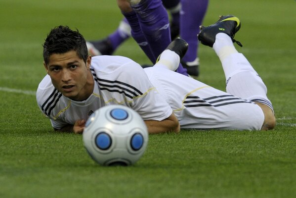 Show Ronaldo on the field with the ball