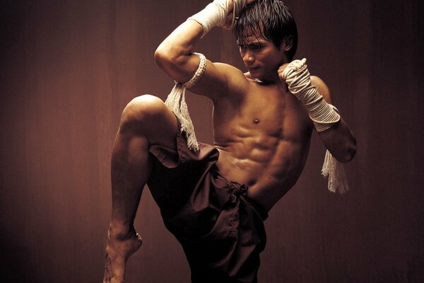 A man on Thai boxing in a pose