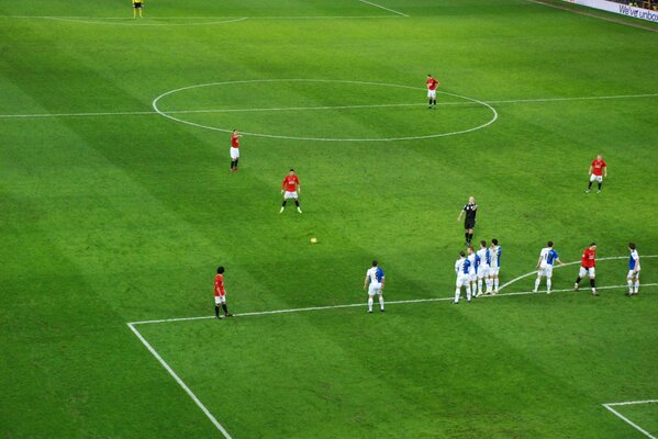 Players during a match on a football green field