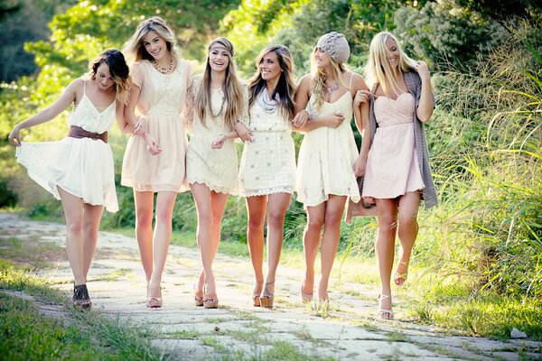 Girlfriends in nature in dresses