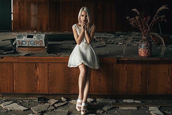 Blonde girl in an abandoned building