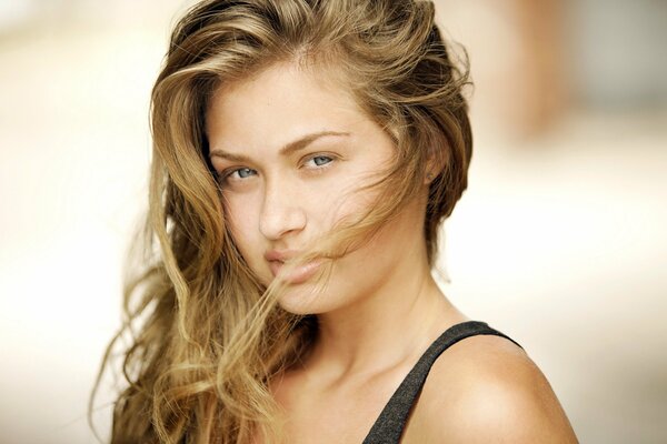 A girl with loose hair flowing in the wind