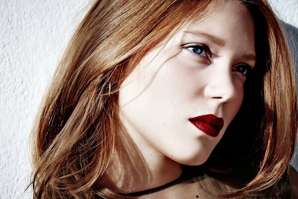 Lea Seydoux with bright red lipstick on her lips