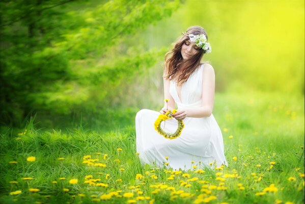 A girl with a wreath in her hands