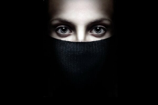 Girl s eyes on a black background