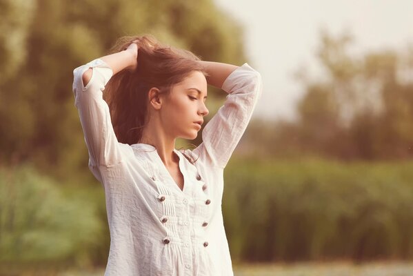 Ksenia Kokoreva in a white shirt