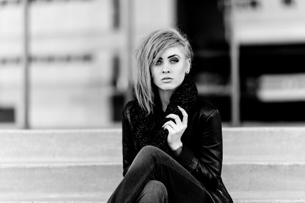 Black and white photo of a girl with a haircut on one side