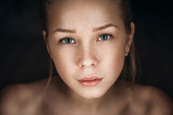 Young girl with freckles beautiful portrait