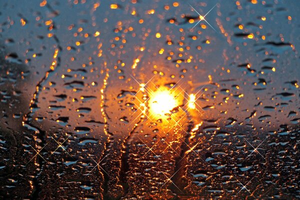 Raindrops and sunset on the glass