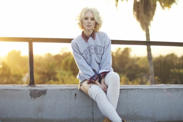 Blonde girl in a sweater