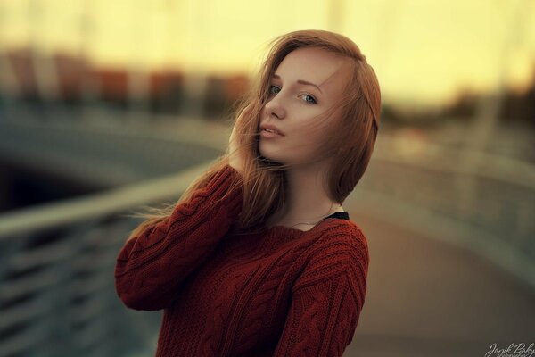 Portrait of a pretty girl in a knitted sweater