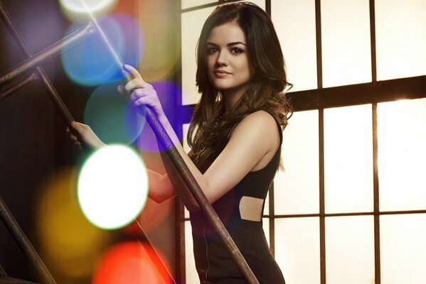 Lucy Hale on the background of the window