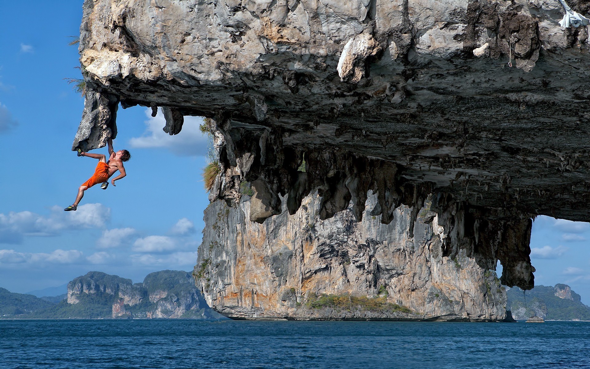 hombre rocas ojos de ámbar azul agua mar deportes océano