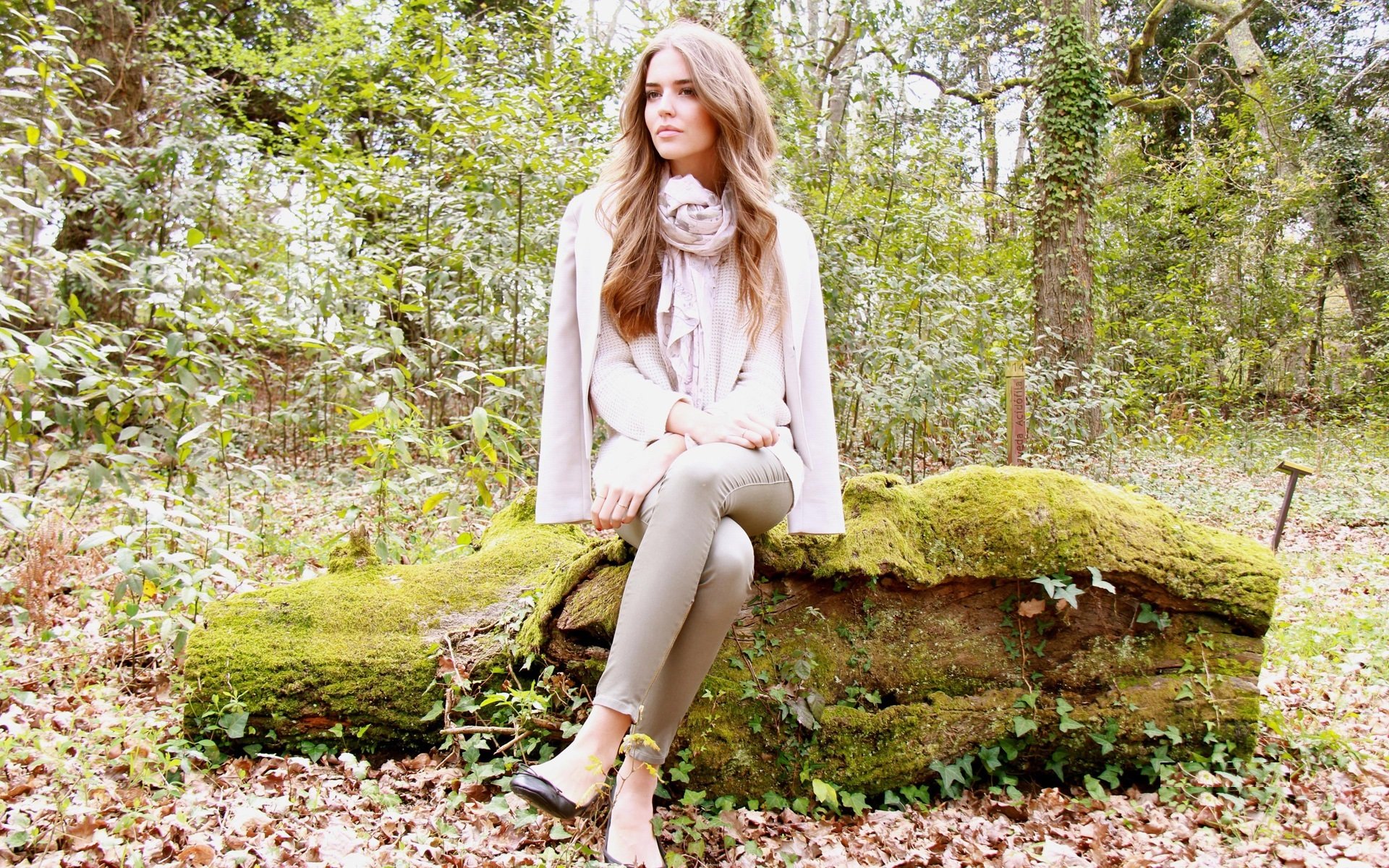 clara alonso model sitting heels view scarf log nature leaves autumn