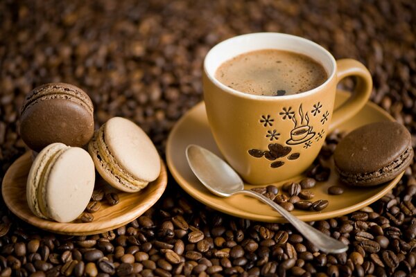 Coffee beans with macaroons on a saucer