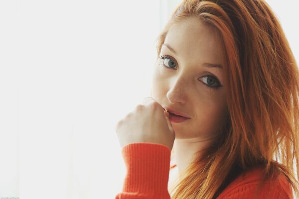 Red hair on an orange background